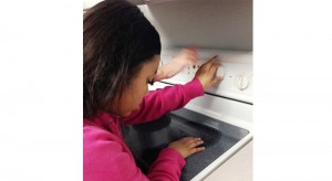 STEPS Junior student at stove top