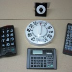 Phones, calculator and TV remote display
