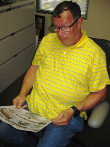 Peter reading a newspaper