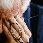 Frustrated man covering his eyes