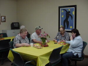 Group of volunteers enjoy a meal together